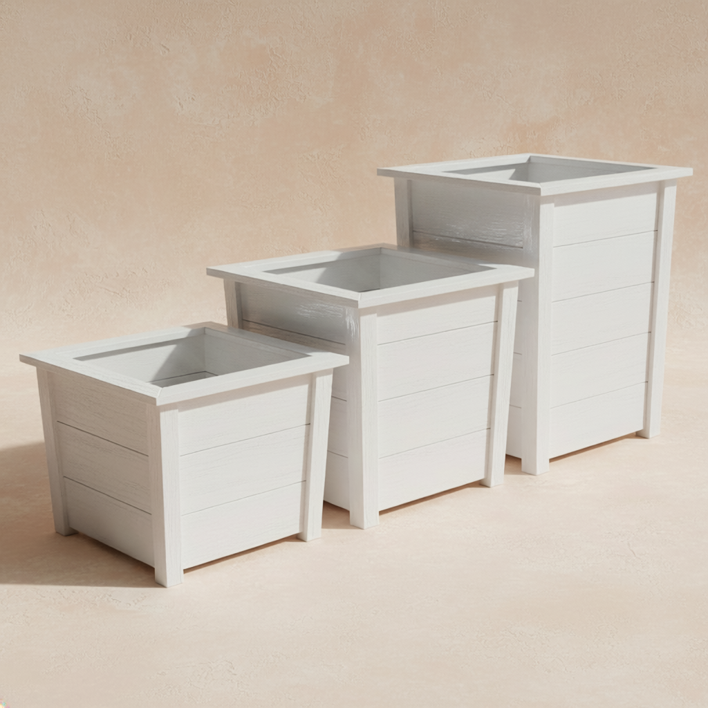 Set of three white wooden planters on a beige background