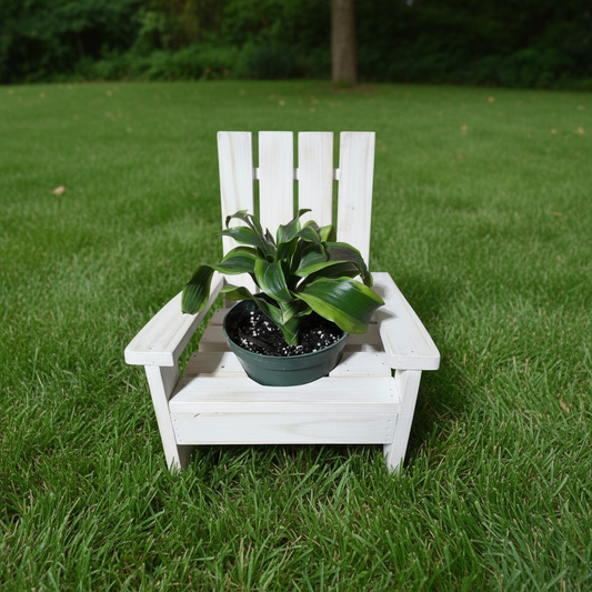 White wooden adirondack planter chair with a potted plant