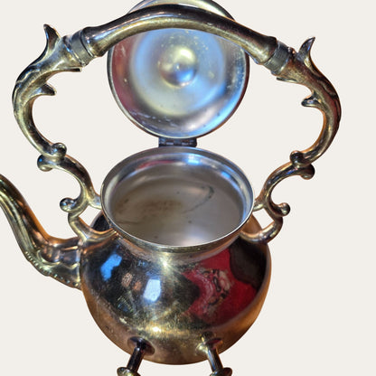 Vintage Ornate Silver-Plated Teapot With Intricate Handle Design And Hinged Lid