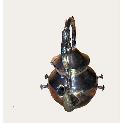 Vintage Ornate Silver-Plated Teapot With Intricate Handle Design And Hinged Lid