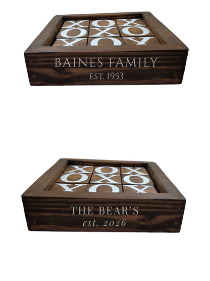 Two wooden tic-tac-toe boards with engraved text on a white background